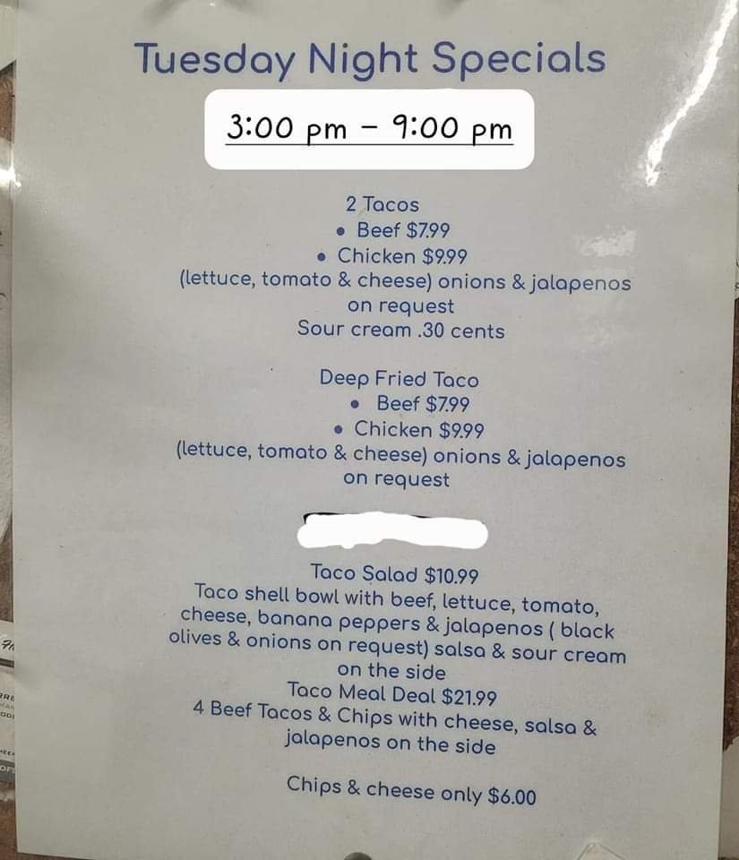 Printed menu highlighting seafood and steak dishes.